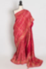 Front full-length view of the rani pink hand embroidery soft Dola silk Banarasi saree draped on a mannequin.