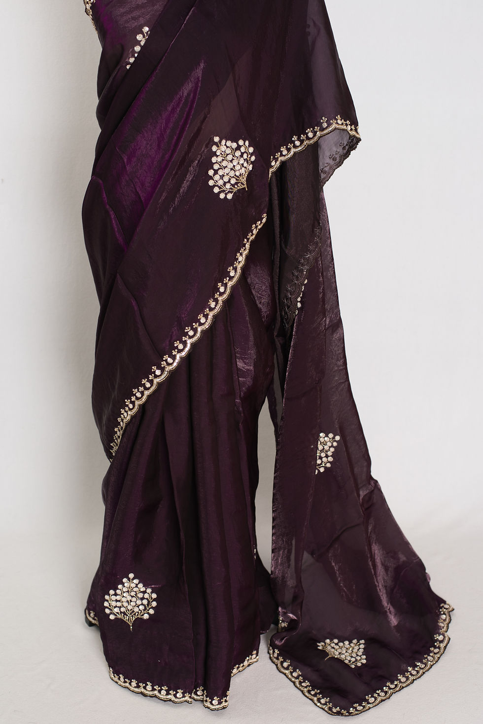 Thumbnail: Rini deep purple glass tissue partywear saree featuring intricate hand-embroidered cut dana work.