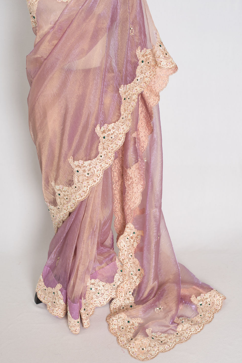 Thumbnail: Front full-length view of the lavender soft tissue partywear saree draped on a mannequin.