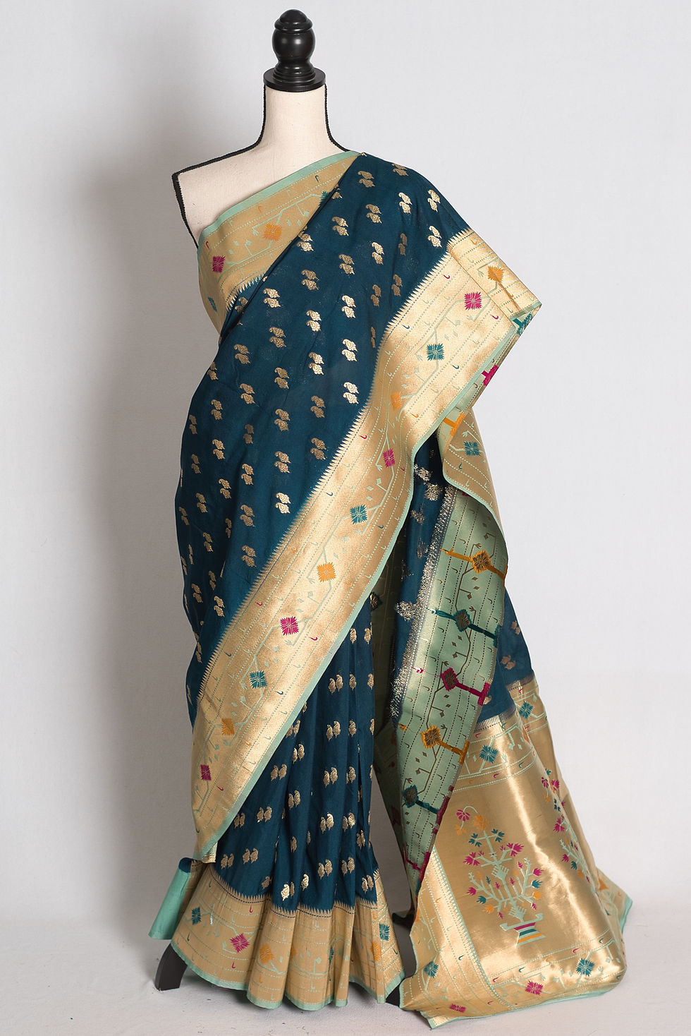 Blue Paithani Inspired Semi Silk Saree draped on a mannequin showcasing its light blue border and rich pallu.