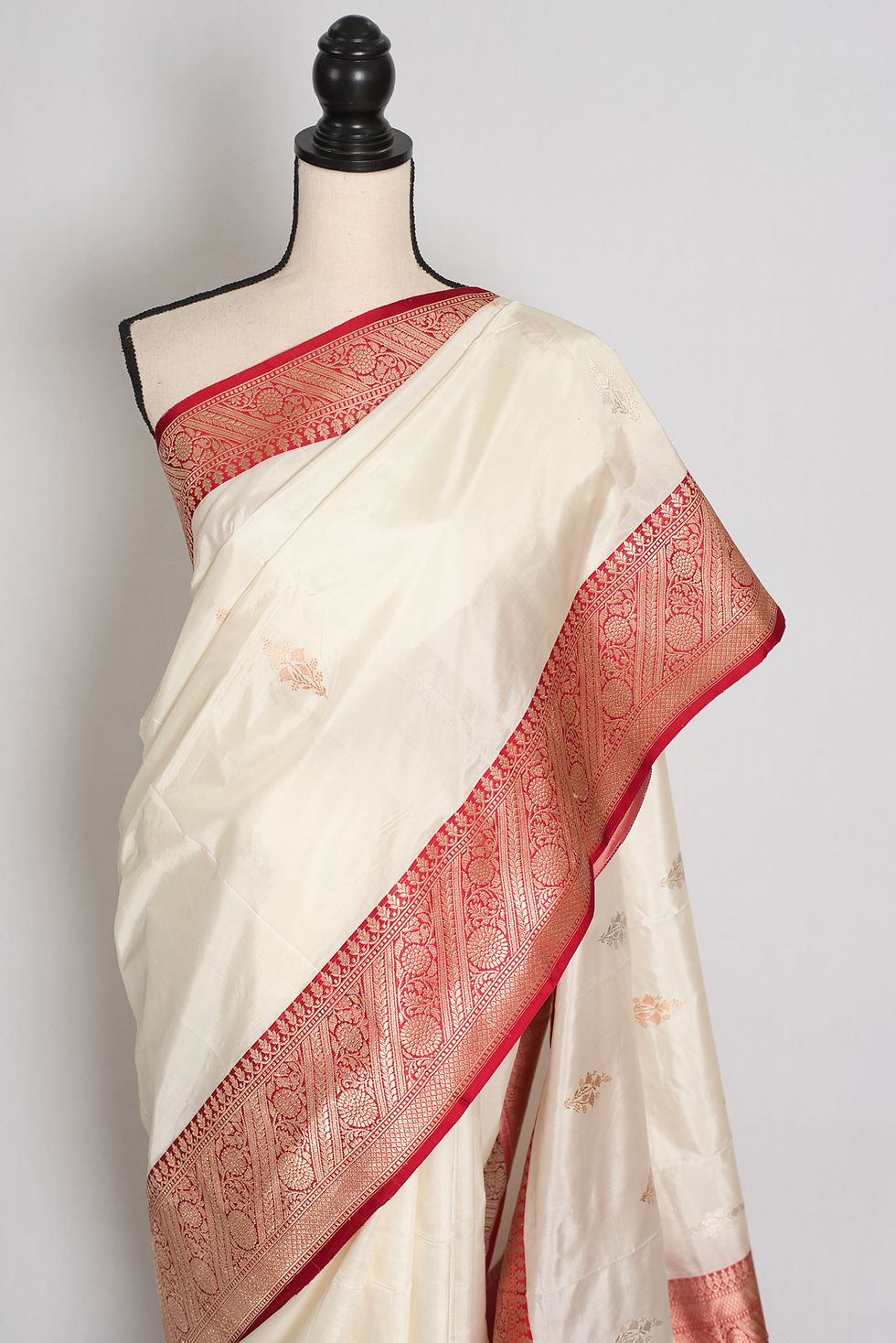 Thumbnail: Off-white and red handwoven pure silk Banarasi saree with silver zari bootis, rich red zari border, and matching blouse piece