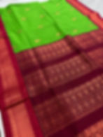 Naaz parrot green blended cotton Gadwal saree showcasing the intricate dark red zari pallu.
