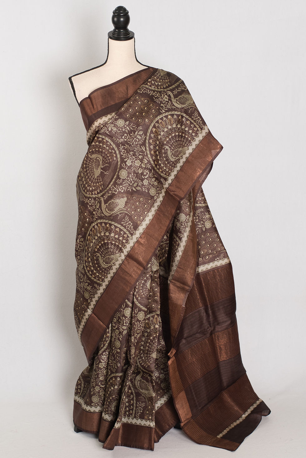 Silk Mark certified earthy brown pure Tussar silk saree featuring traditional intricate Kalamkari art prints.