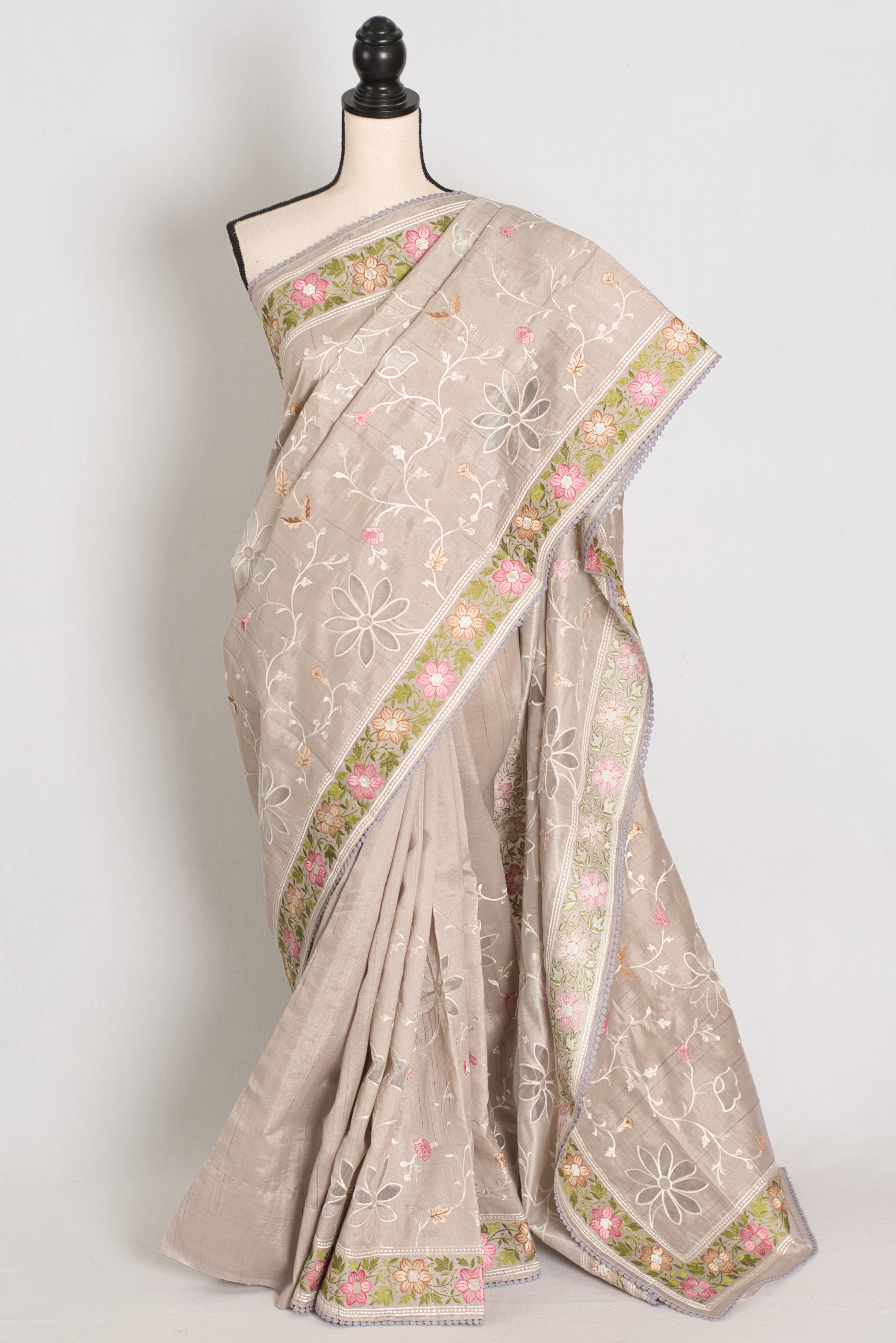 Sriti Dove Grey semi Tussar silk saree with colorful floral cut work embroidery displayed on a mannequin.
