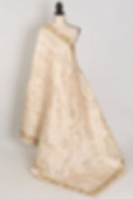 Shreya cream semi Tussar silk saree with multi-color floral embroidery and cut work on a mannequin.