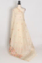 Elegant beige blended cotton saree featuring intricate multi-color thread machine embroidery on the body and border.