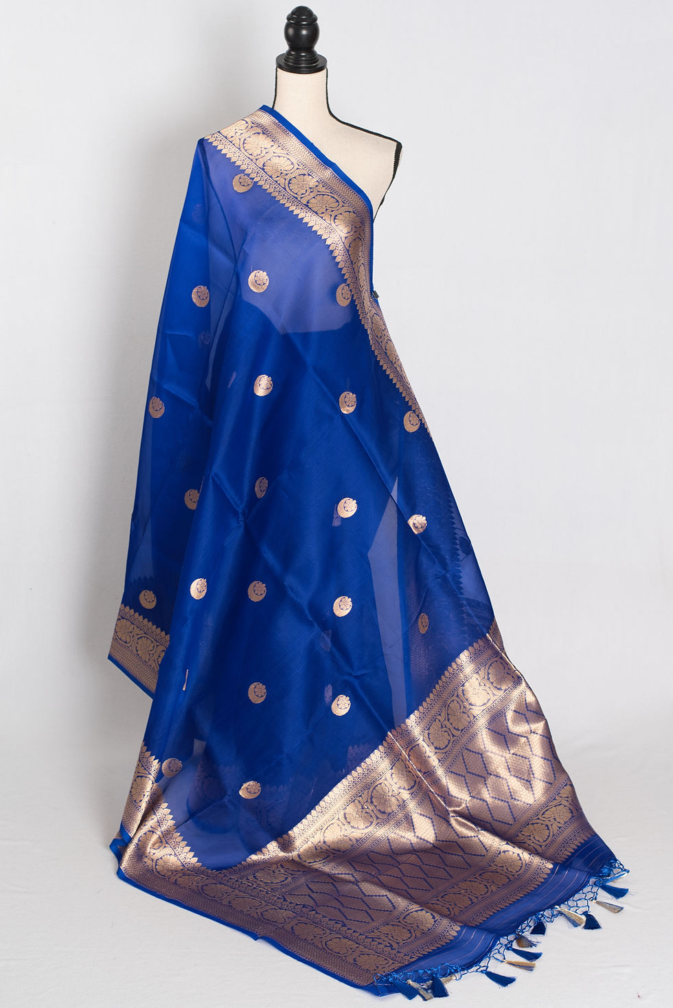 royal blue and gold kora organza banarasi saree featuring hand woven chand sitara motifs on a mannequin drape.