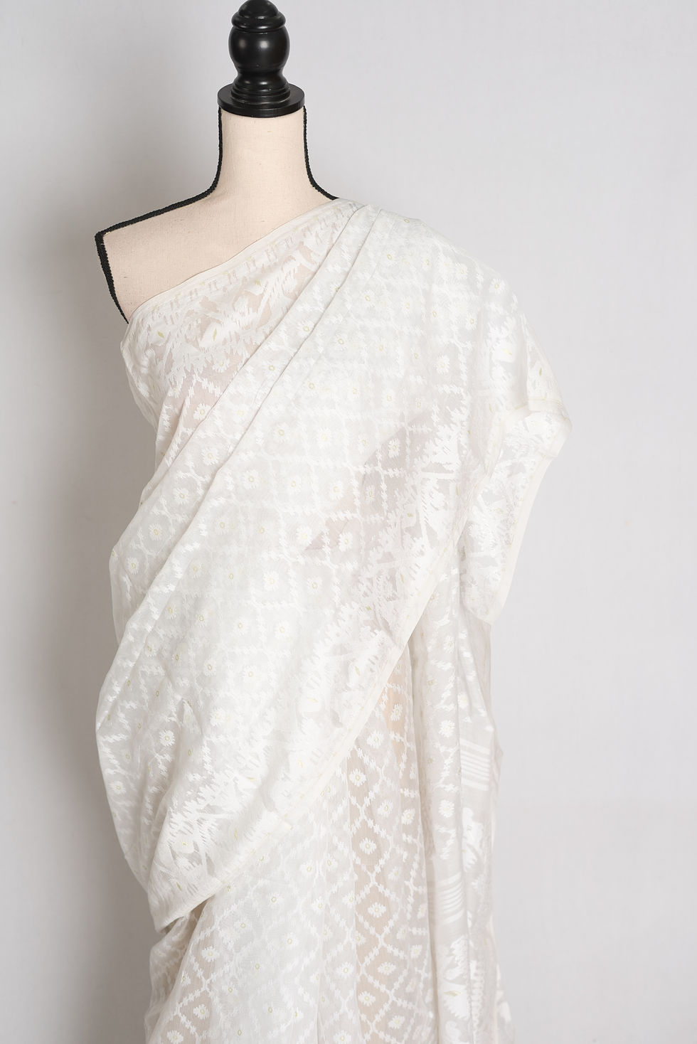 Thumbnail: Soft white blended cotton Bengali Jamdani saree featuring white-on-white geometric diamond lattice motifs.
