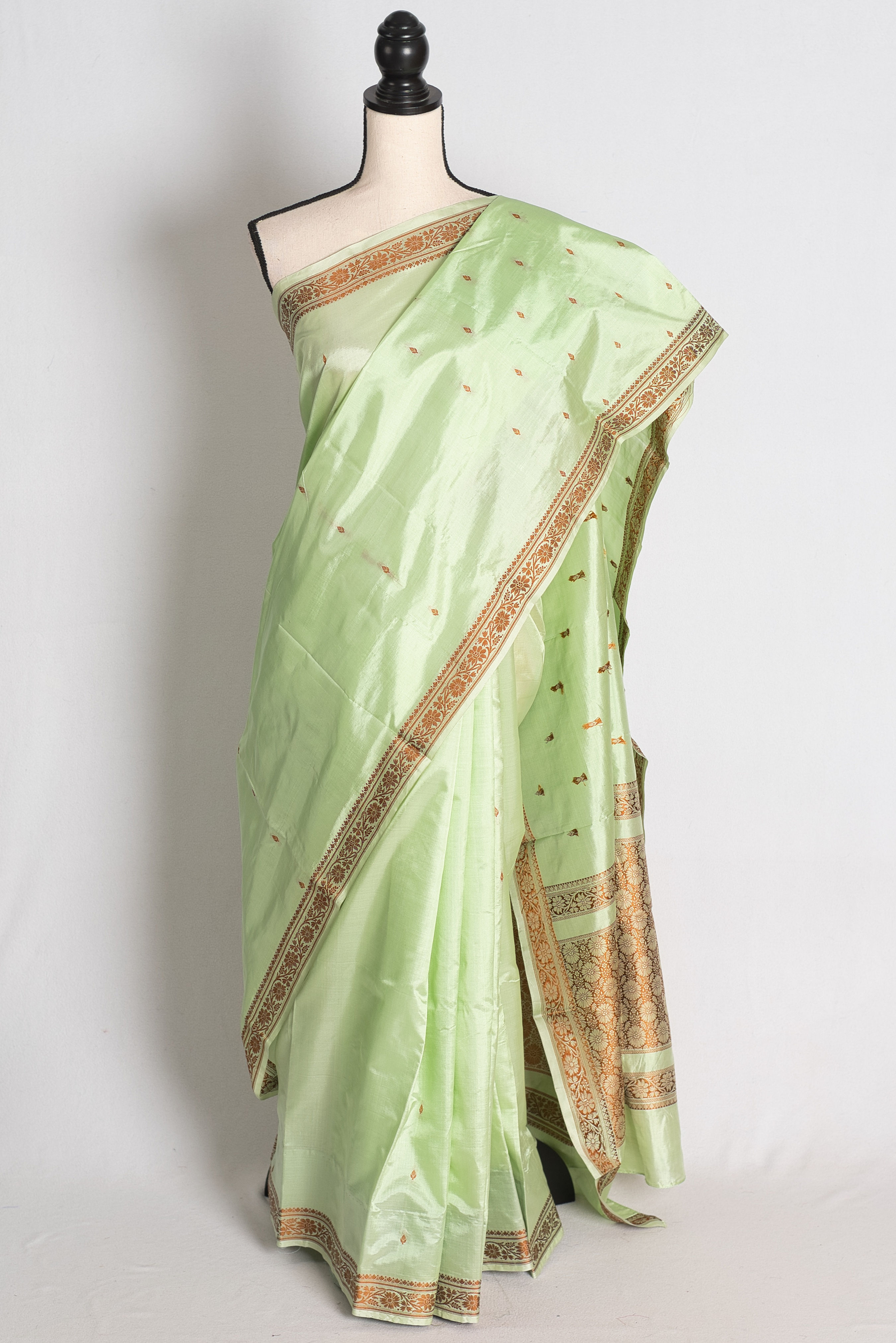 Sea Green Banarasi Silk Saree draped elegantly on a mannequin showcasing its resham thread woven border and pallu.