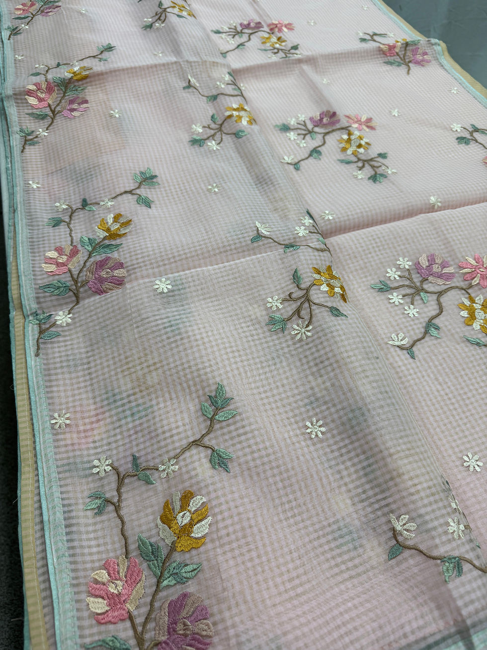 Thumbnail: Rohini collection: Pink blended cotton kota saree with floral embroidery, self checks, and sky blue piping border.
