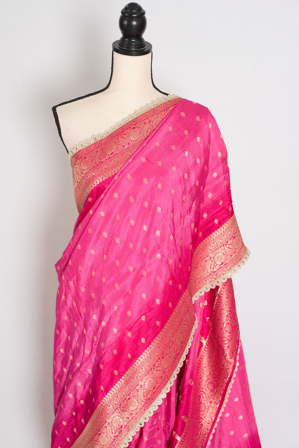 Thumbnail: Front view of the pink and gold Dola silk Banarasi saree draped on a mannequin.