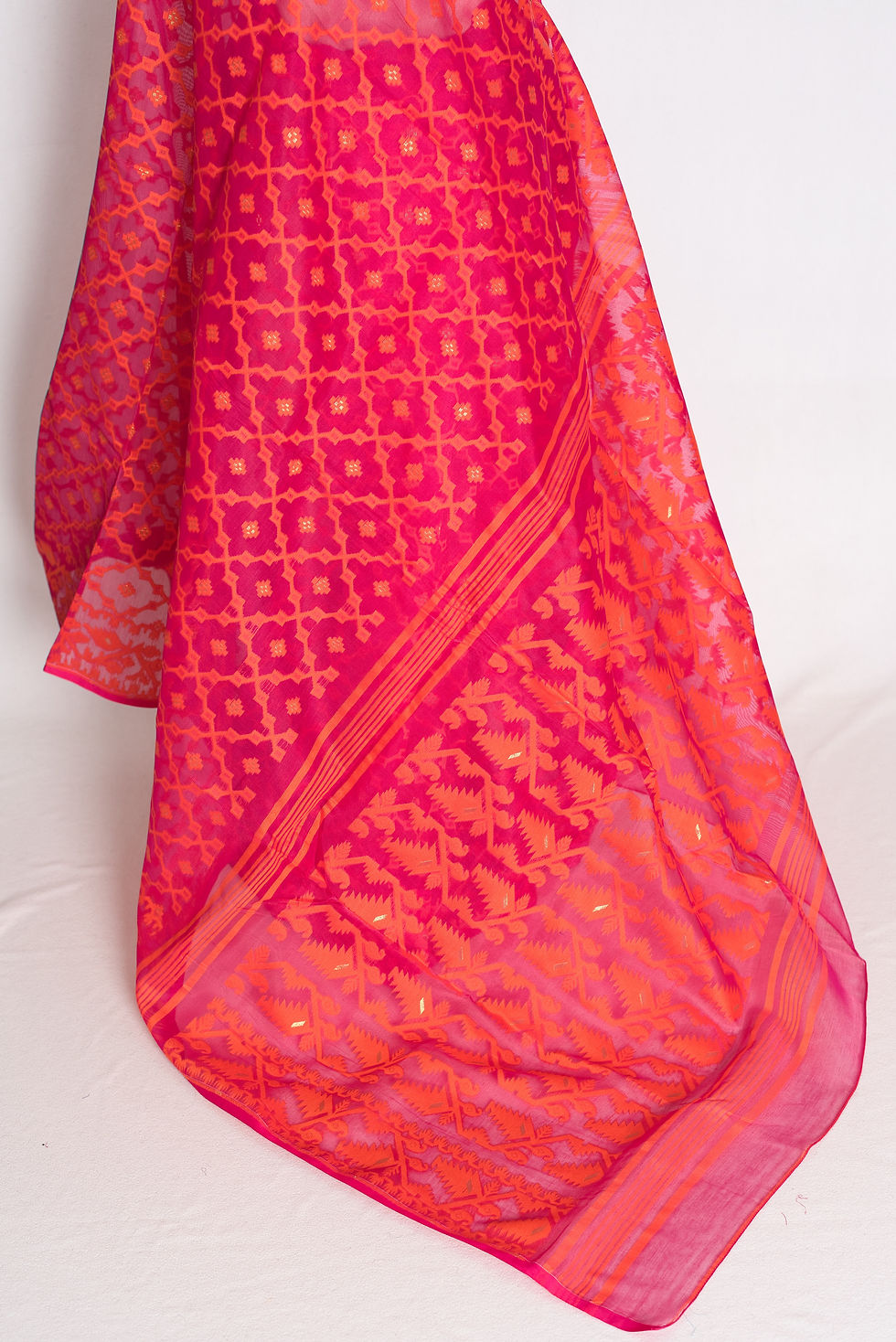 Thumbnail: Close-up view of the pink and orange blended cotton saree drape, highlighting the detailed border and soft weave texture.