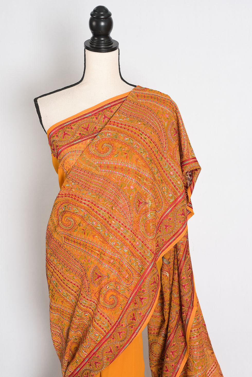Thumbnail: Full length front view of the Nirja orange georgette saree featuring dense all-over Kashmiri machine embroidery.