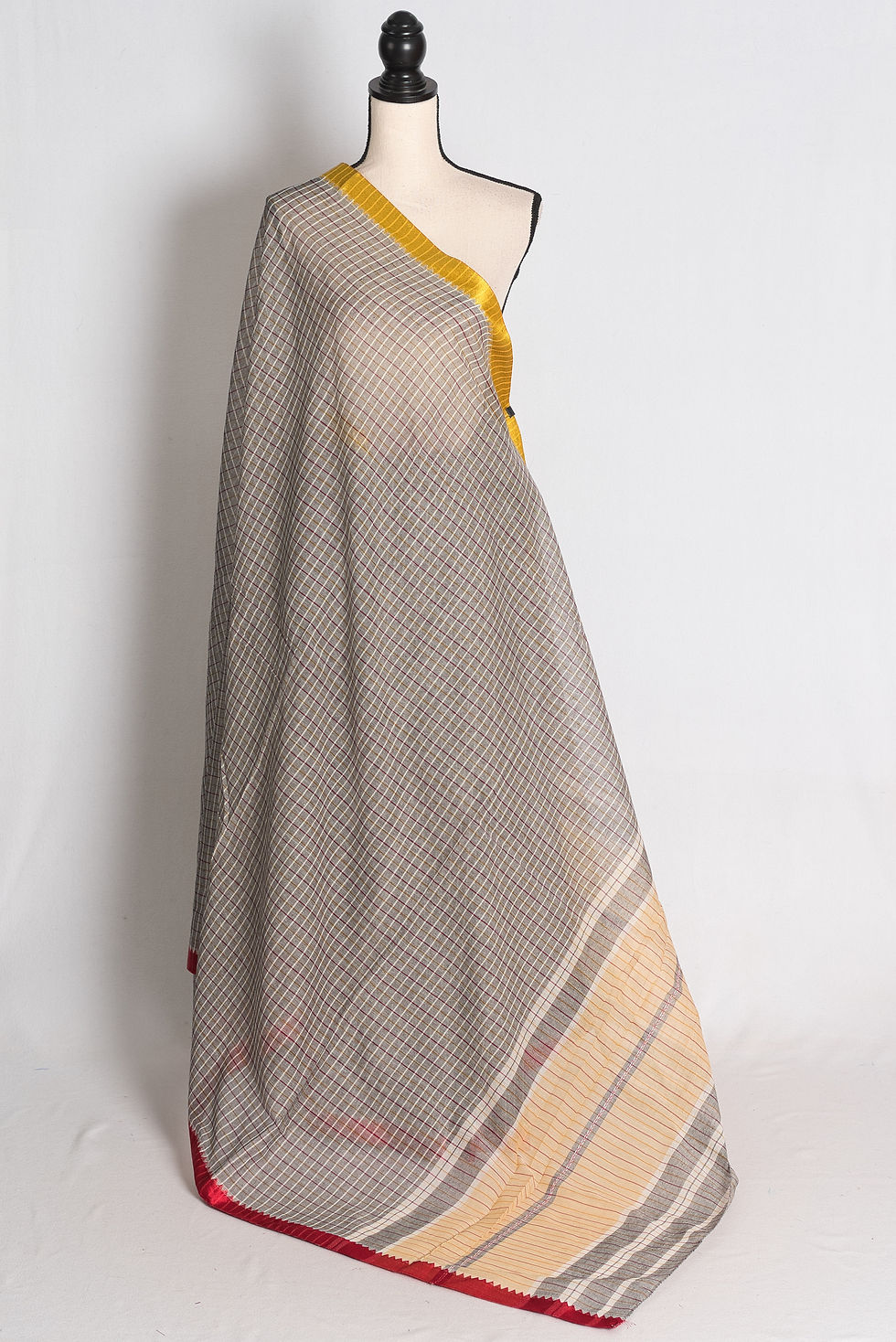 Grey Dhaniakhali Soft Cotton Saree draped elegantly on a mannequin showcasing its contrasting yellow and red border.