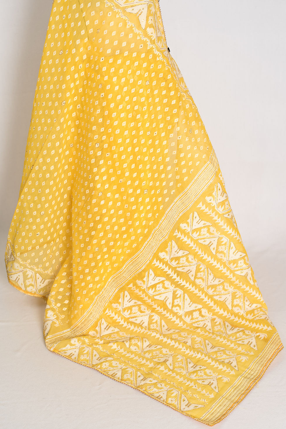 Thumbnail: Full length front view of the Gita yellow and white blended cotton Jamdani saree with hand embroidery draped on a mannequin