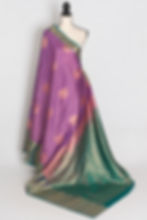 Mauve semi silk Kanjivaram saree with a wide sea green contrast border and gold zari details draped on a mannequin.