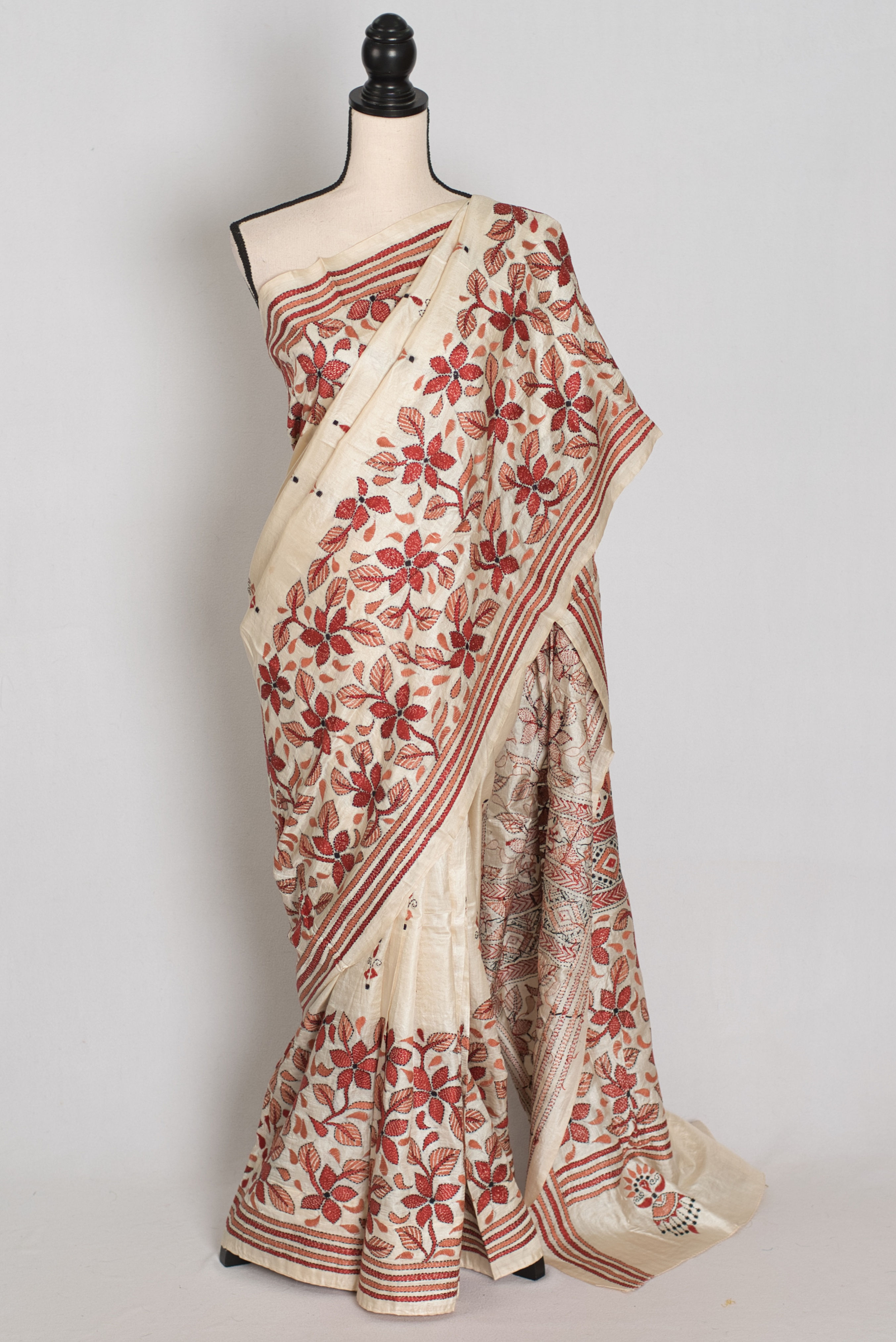 Cream pure Bangalore silk saree with rust brown hand-embroidered Kantha stitch floral vines draped on a mannequin.