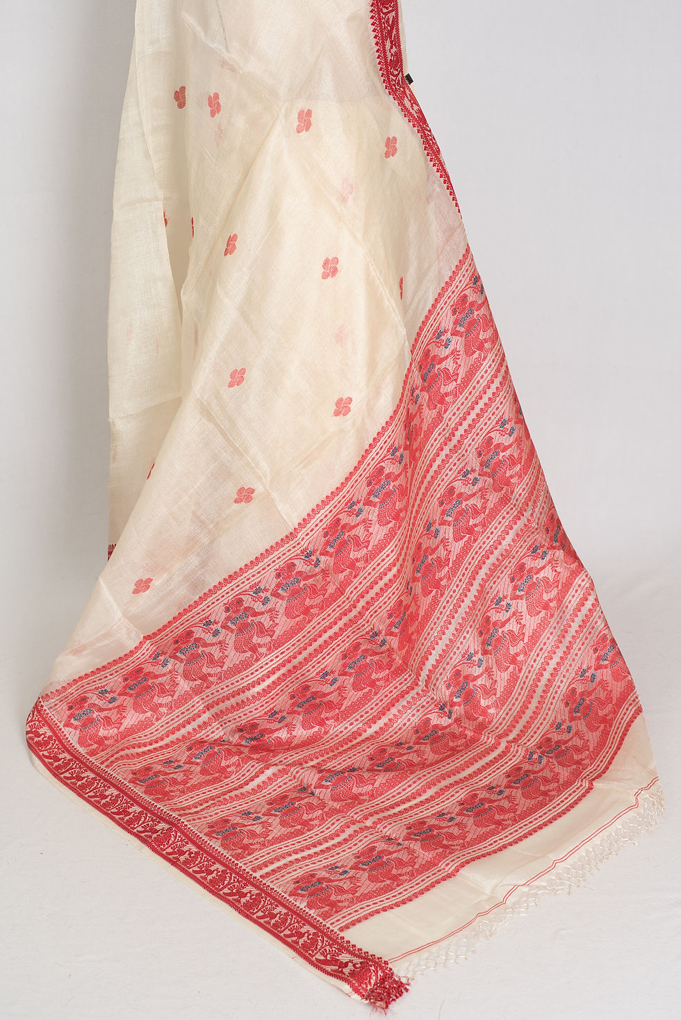 Thumbnail: Traditional cream and red Tussar silk saree with red border on a mannequin, classic Bengali style.