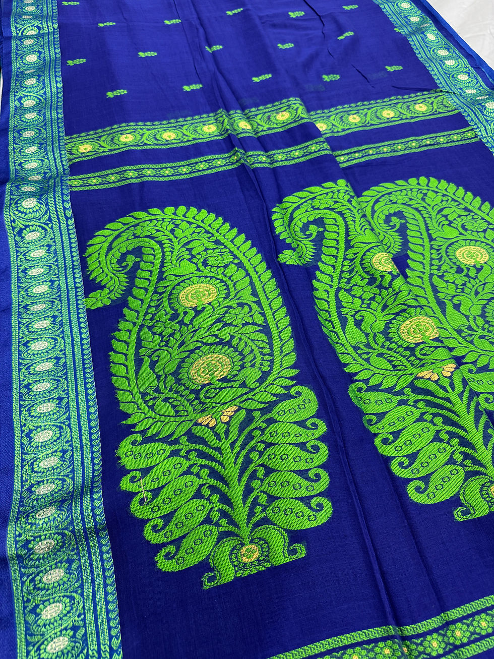 Thumbnail: Blue and parrot green Bengal handloom soft cotton Baluchari saree featuring intricate paisley pallu motifs.