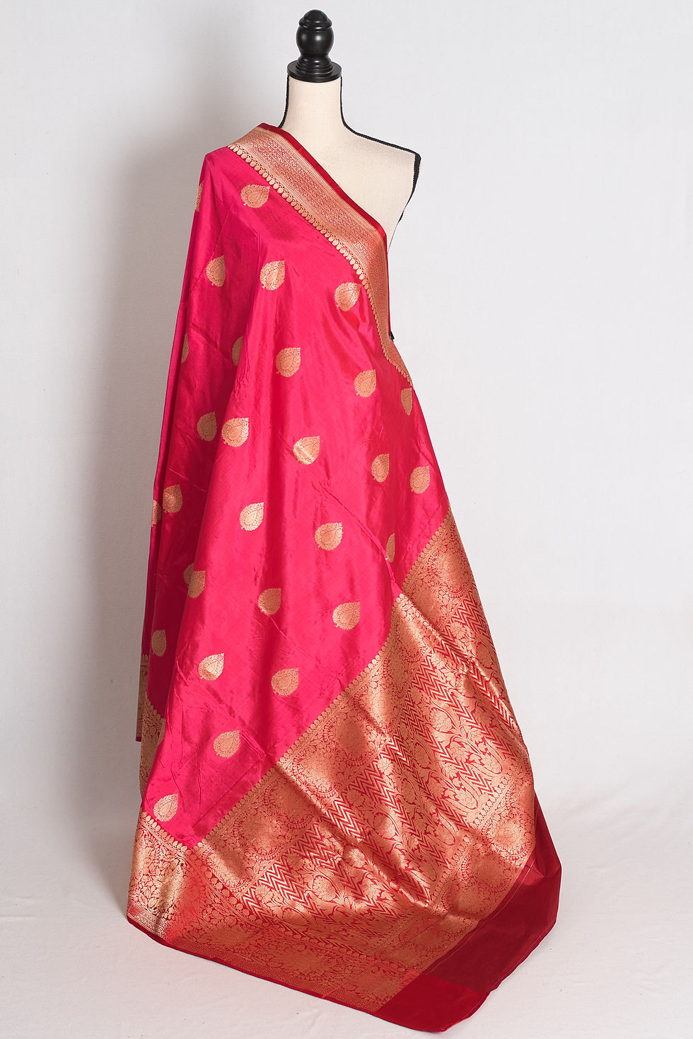 Pink and Maroon Banarasi Katan Silk Saree draped elegantly on a mannequin.
