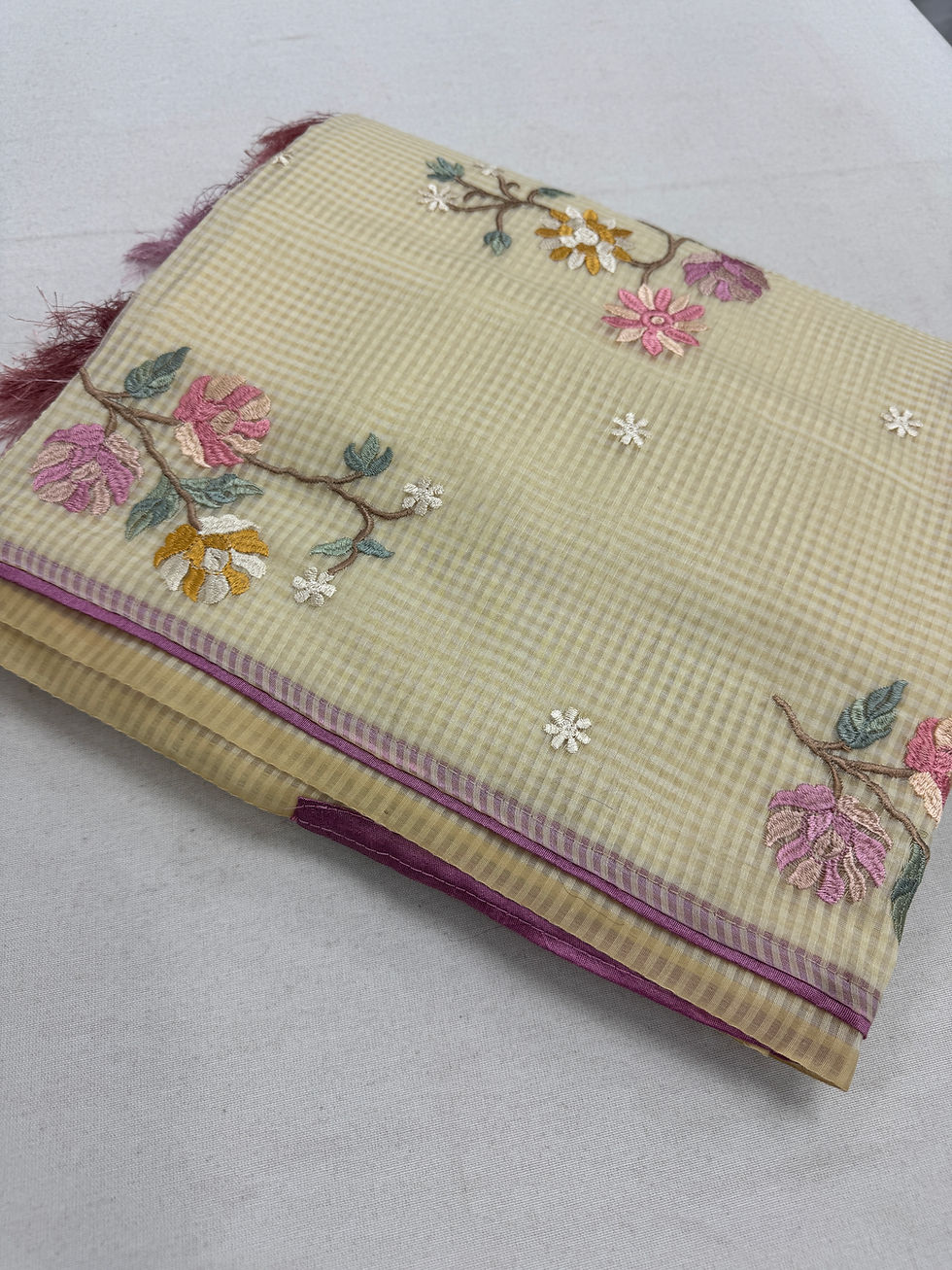 Srija collection: Bright yellow blended cotton kota saree with machine floral embroidery and pink piping border.