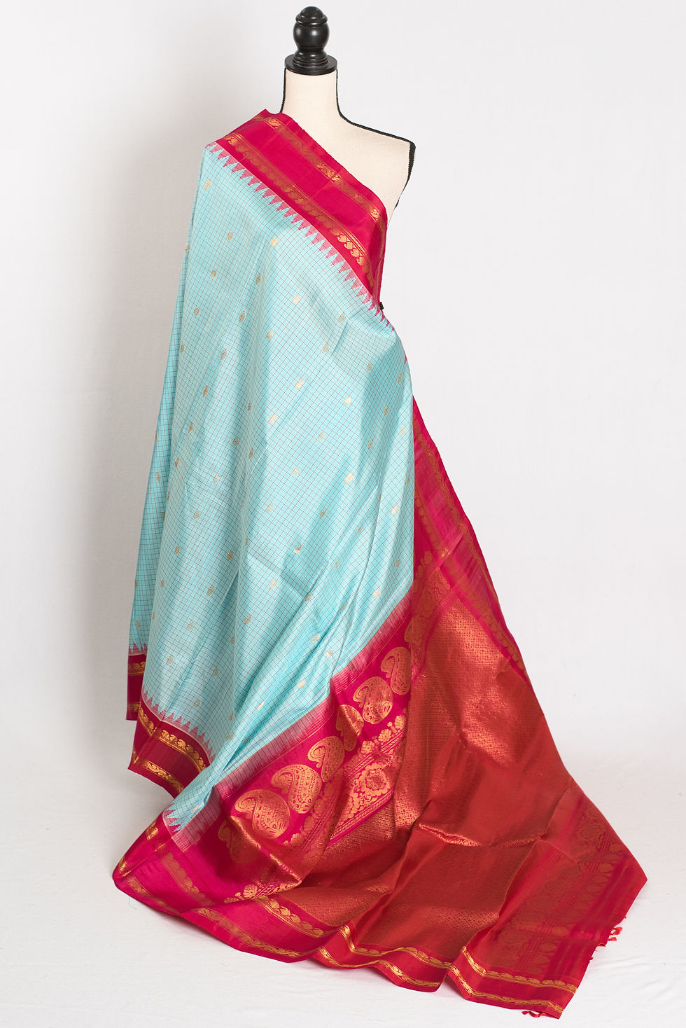 Sky blue and pink micro-check Gadwal silk saree with golden zari border.