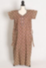 Full-length view of a hena green pure cotton nighty on a mannequin, showcasing an all-over Kalamkari circular print and side