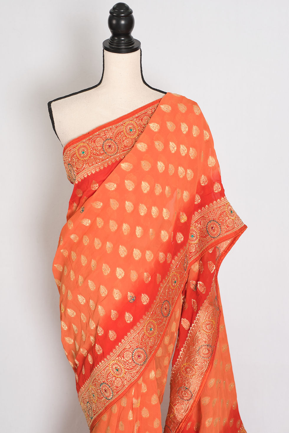 Thumbnail: Front full-length view of the orange and red semi khaddi georgette Banarasi saree draped on a mannequin.