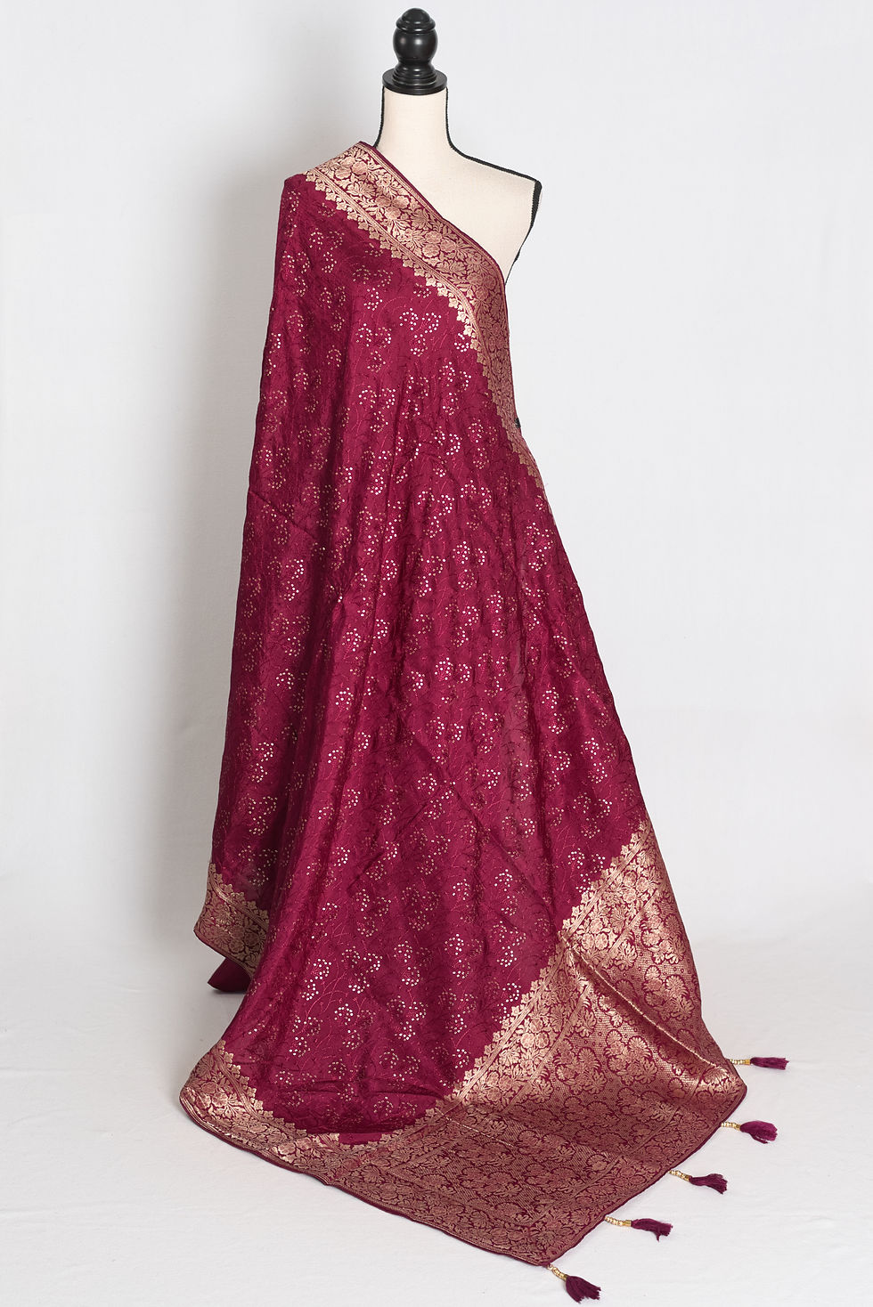 Full length view of the purple Dola silk Banarasi saree showcasing its fluid drape and gold zari border on a mannequin.