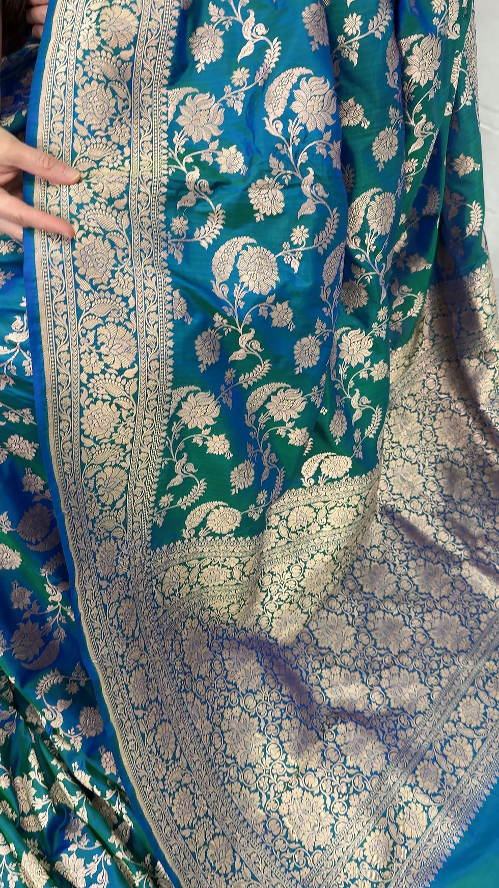 Video of Peacock green bridal Banarasi silk saree with an all-over gold zari floral jaal (Irani).