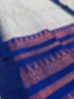 Gray and blue blended cotton saree with copper temple border and matching blouse piece.