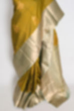 Thumbnail: Full length front view of the Harini olive green semi silk Kanjivaram saree with a wide contrast sage green gold zari border