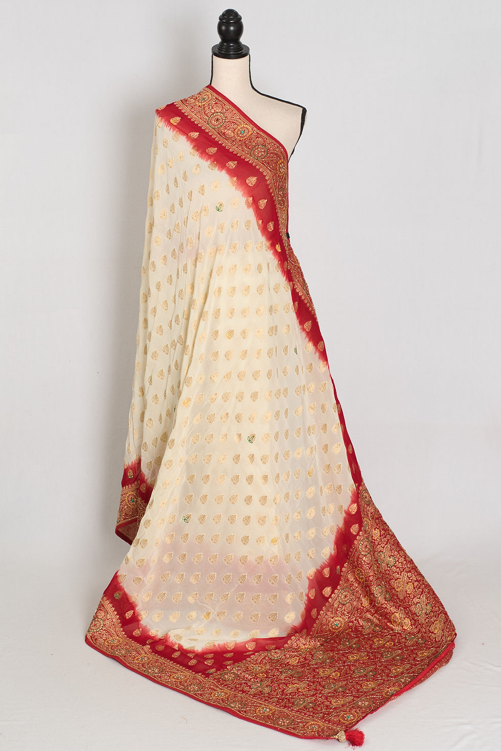 Front full-length view of the off-white and maroon crepe georgette Banarasi saree draped on a mannequin.