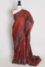 Brown Bishnupuri silk saree with hand block printed geometric borders and folk motifs draped on a mannequin.