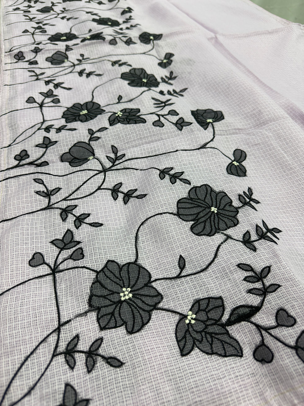 Lavender and black semi kota silk saree featuring floral appliqué work and multi-color machine embroidery.