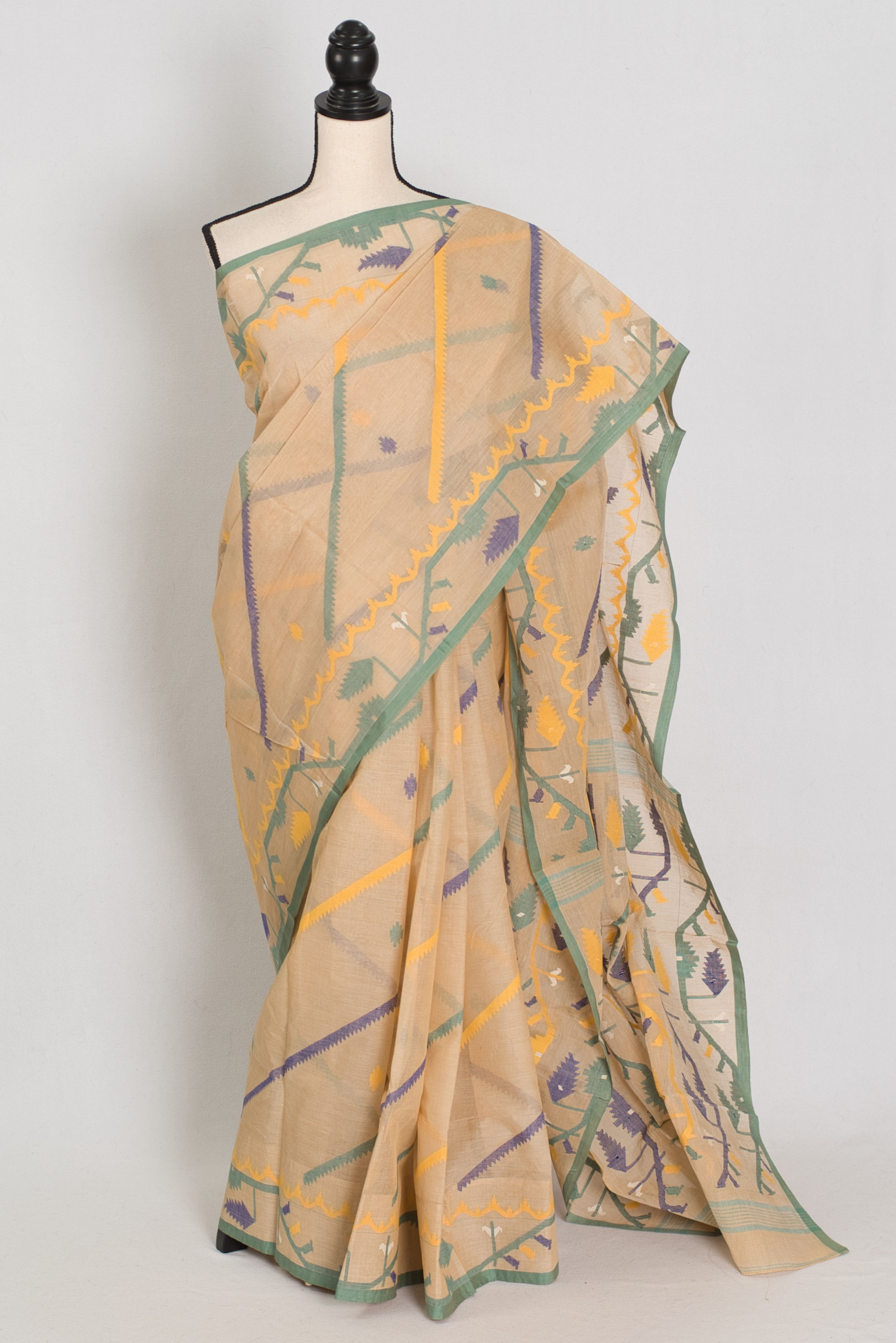 Beige Bengal Handloom Jamdani saree with green, yellow, and purple Karat work on a mannequin.