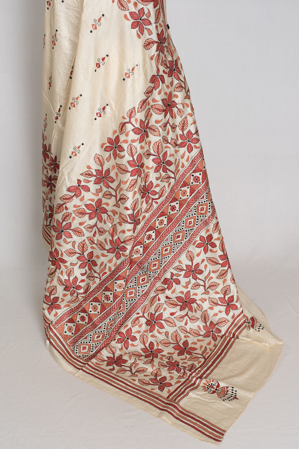 Thumbnail: Cream pure Bangalore silk saree with rust brown hand-embroidered Kantha stitch floral vines draped on a mannequin.