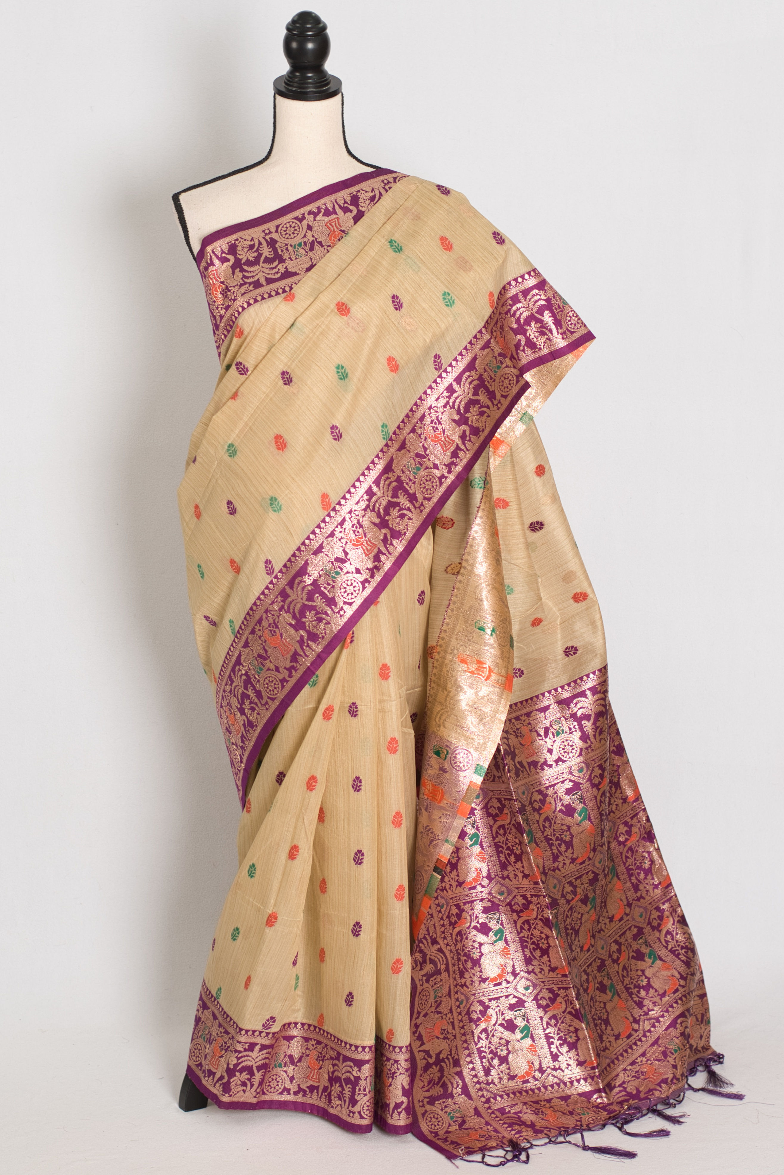 Full view of a beige blended cotton Baluchari saree with a contrast purple border on a mannequin.