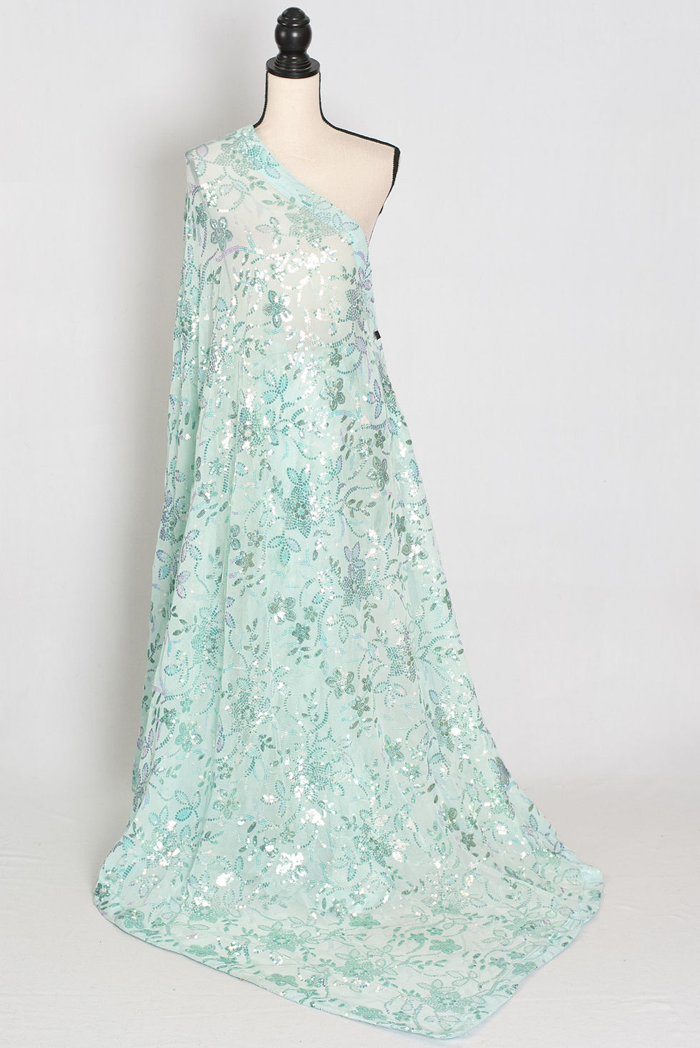Thumbnail: Sea green soft net sequin partywear saree on a mannequin displaying its lightweight fluid drape and floral embroidery