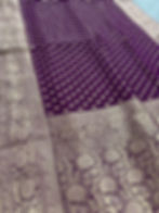 wine and gold crepe georgette banarasi saree showcasing all over gold zari butis and traditional floral borders