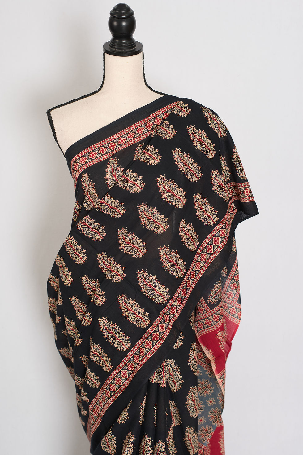 Thumbnail: Kala black mulmul cotton saree featuring traditional ivory and earthy Kalamkari floral prints.