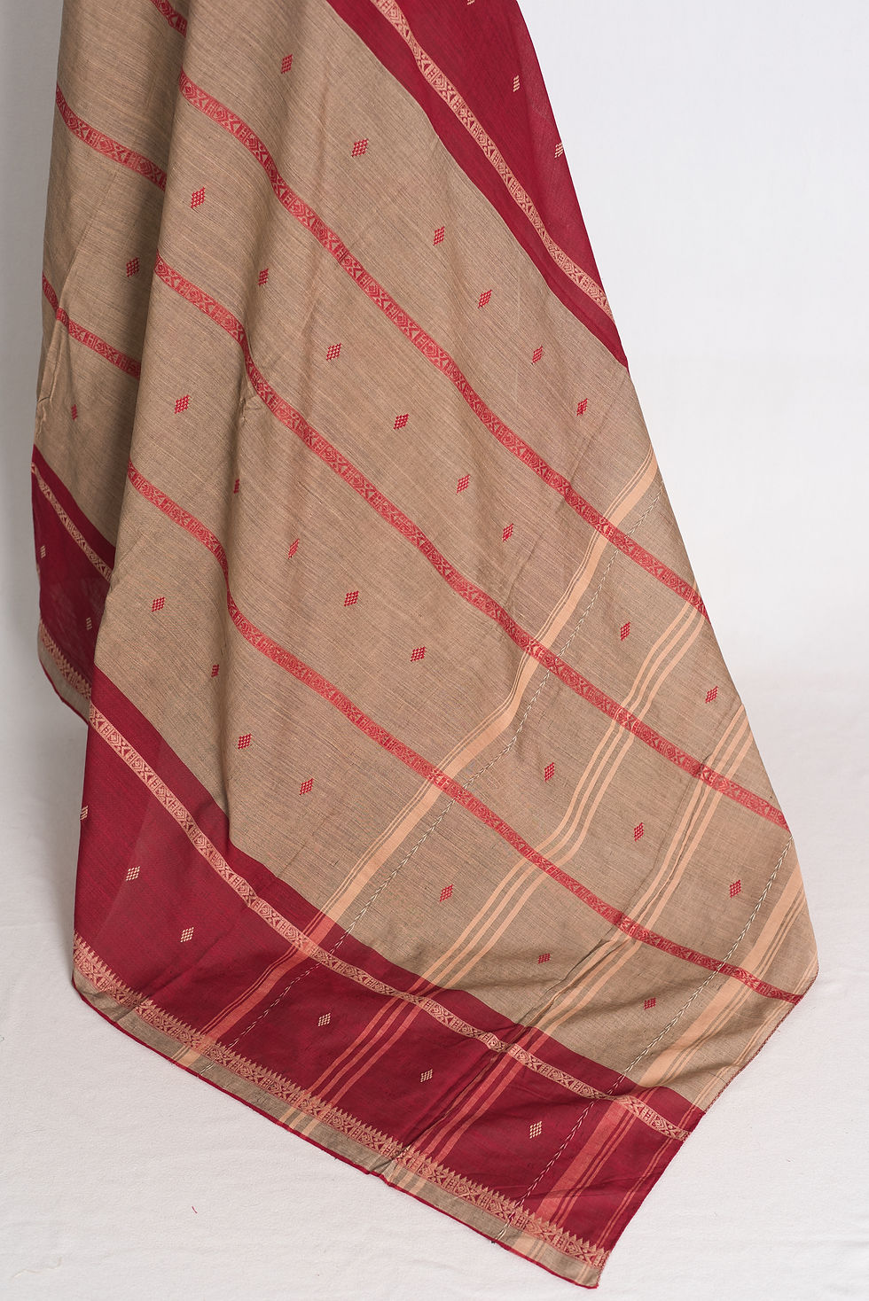 Thumbnail: Brown and Dark Red Soft Cotton Dhaniakhali Saree draped elegantly on a mannequin showcasing its rich borders and traditional