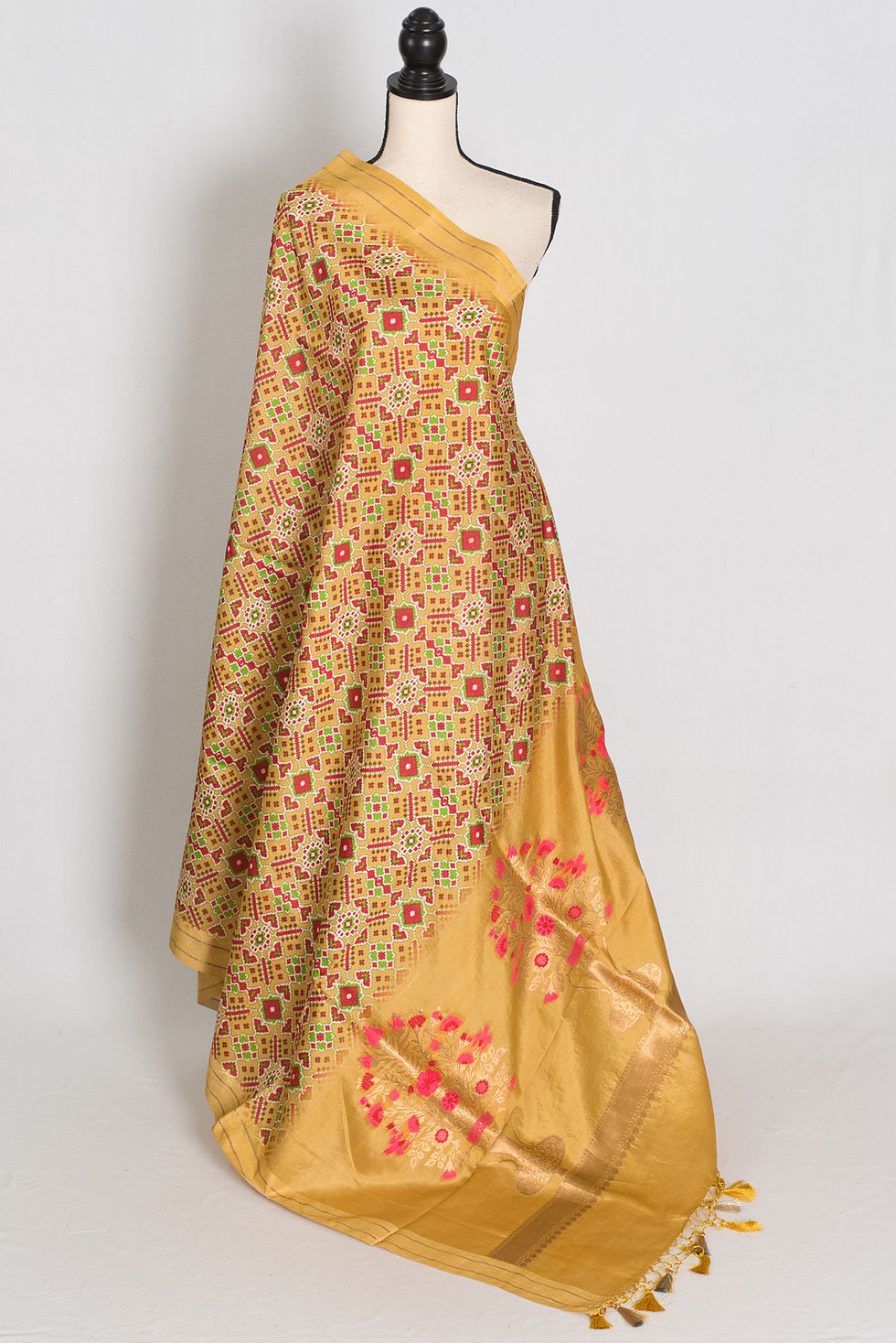 Thumbnail: yellow and gold pure banarasi katan silk saree featuring patola style ikkat print on a full mannequin drape.
