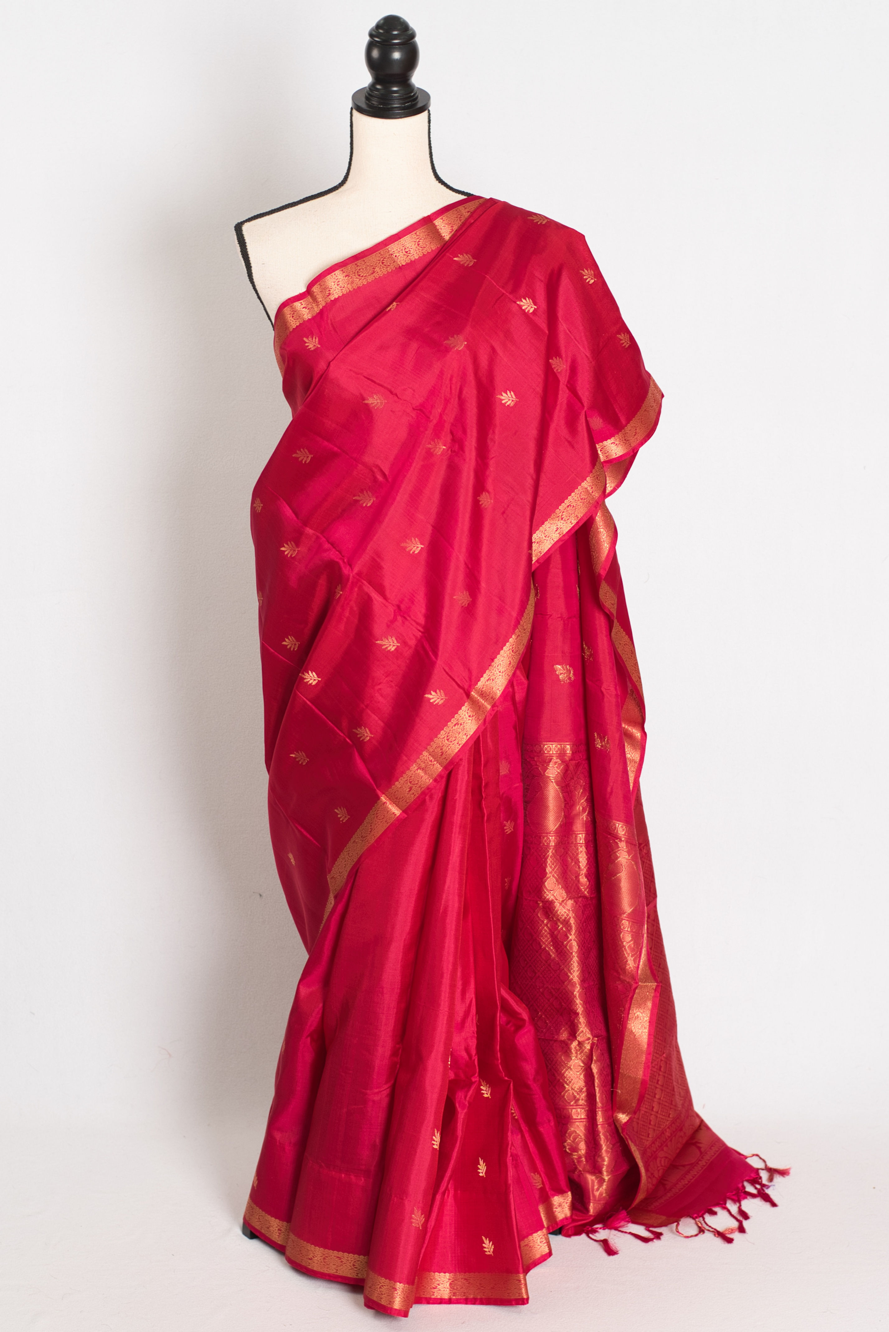 Rani rose pink Kanjivaram silk saree with a small gold border (Nita Collection).