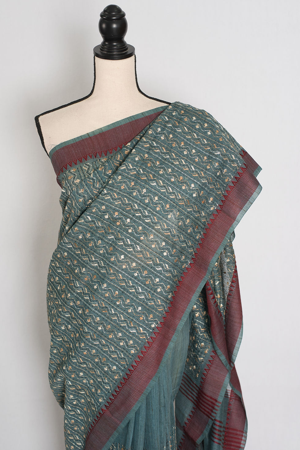 Thumbnail: Steel grey cotton saree displayed on a mannequin showcasing its lightweight structured drape, geometric kantha embroidery