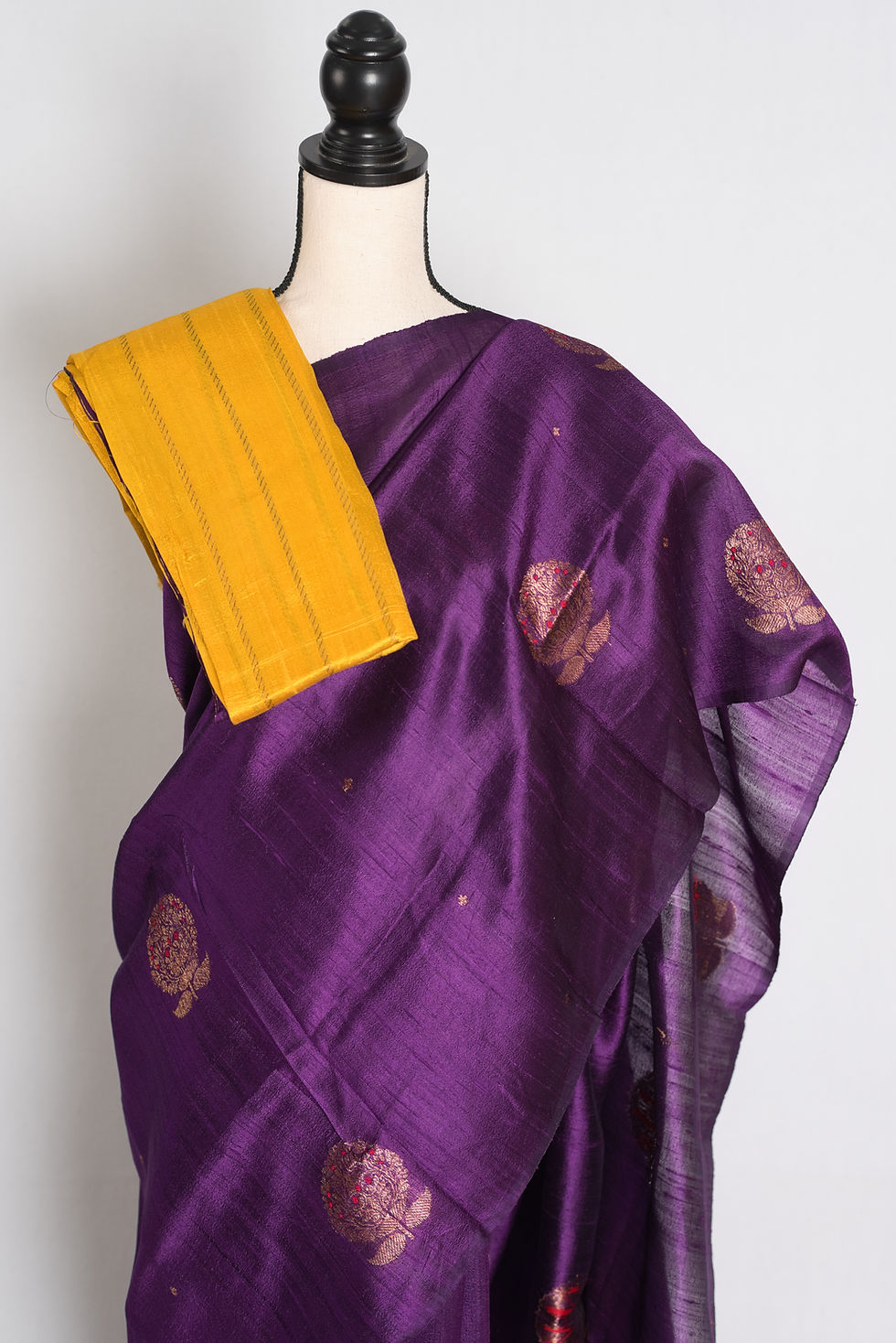 Thumbnail: Deep purple borderless pure raw silk Poth Banarasi saree with antique gold zari and red Minakari floral bootis.