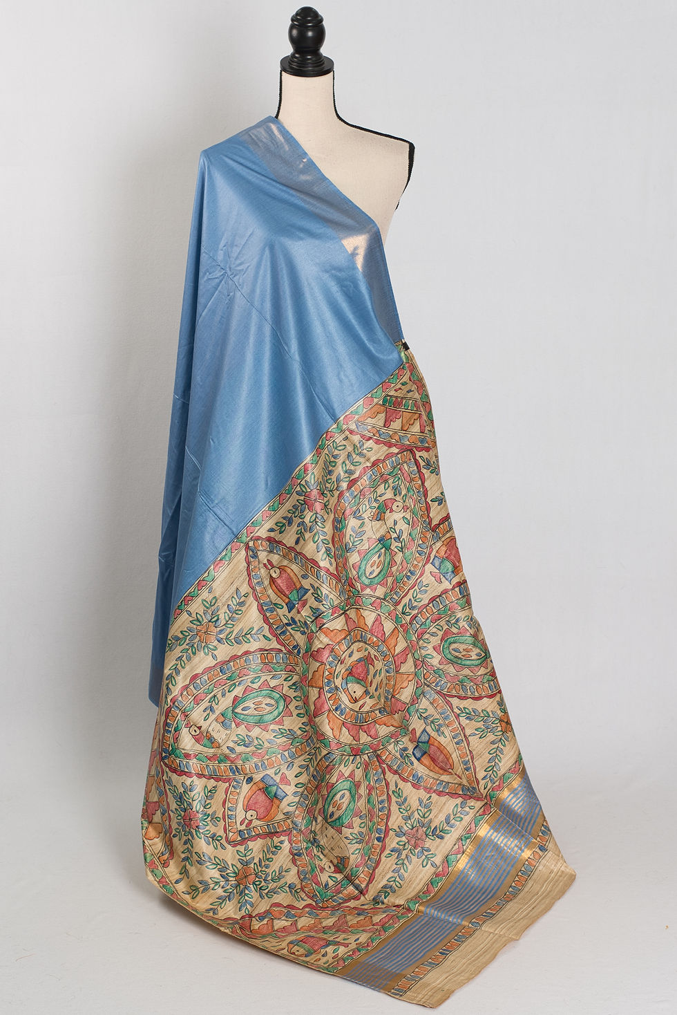 Contemporary blue Tussar saree with a colorful hand-painted Madhubani pallu (Shobha Collection).