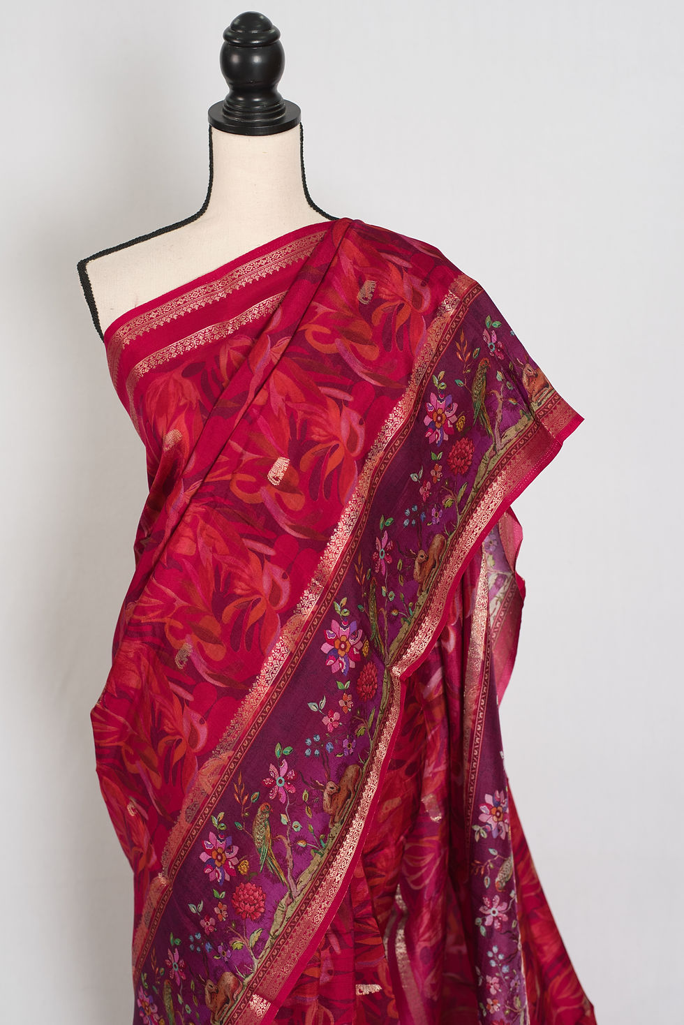 Thumbnail: Dark rose pink dola silk saree featuring a contrasting purple border with vibrant digital floral prints and gold zari framing