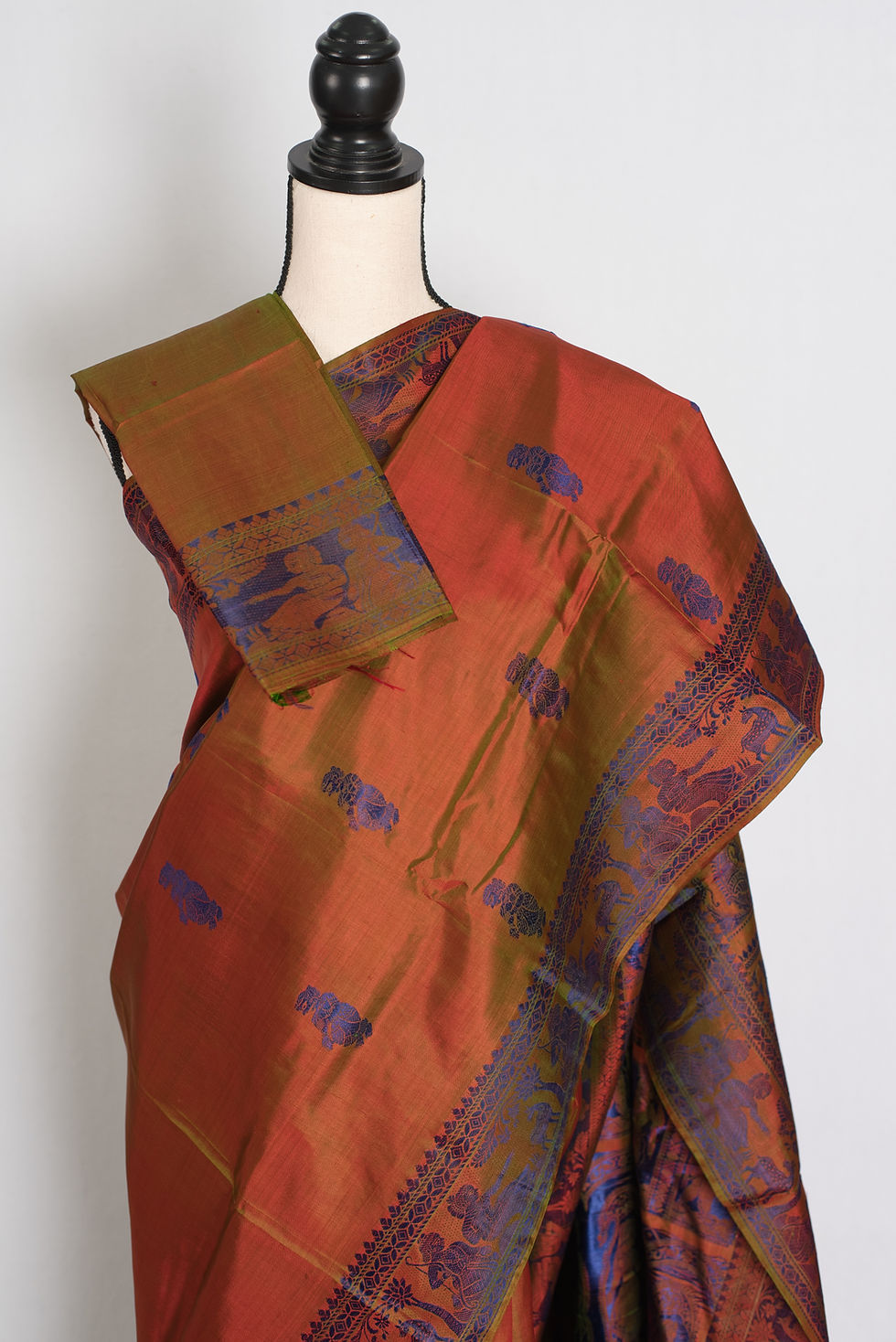 Thumbnail: Front full-length view of the orange and green shot silk handwoven Baluchari saree draped on a mannequin.