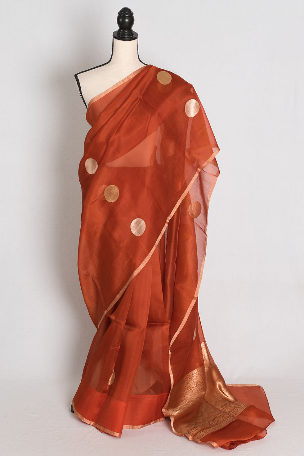 Rust brown Kora organza Banarasi saree featuring large gold zari polka dot woven motifs, slender gold border, zari pallu.